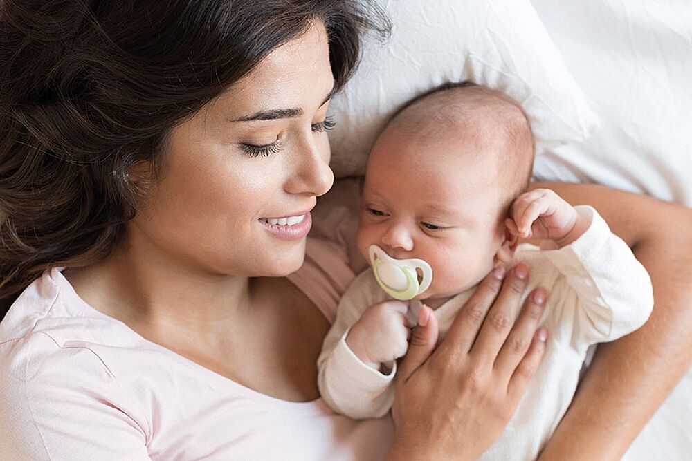 Foto zeigt Mutter mit Baby